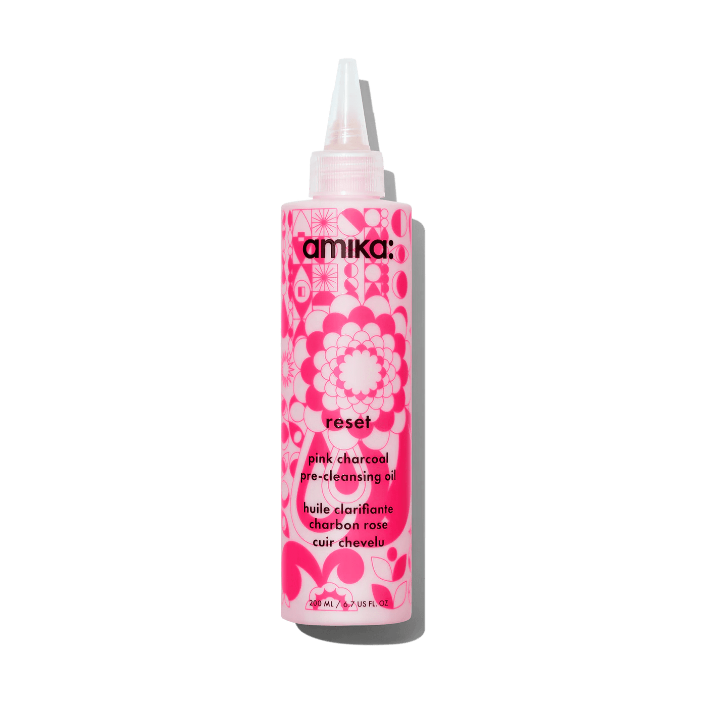 Amika Reset pink charcoal scalp cleansing oil.